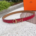 Red leather belt with gold buckle and chain link, tan reverse, stitched edges