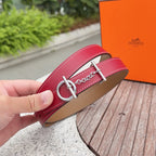 Hermes belt in burgundy with tan underside, silver ring buckle and chain