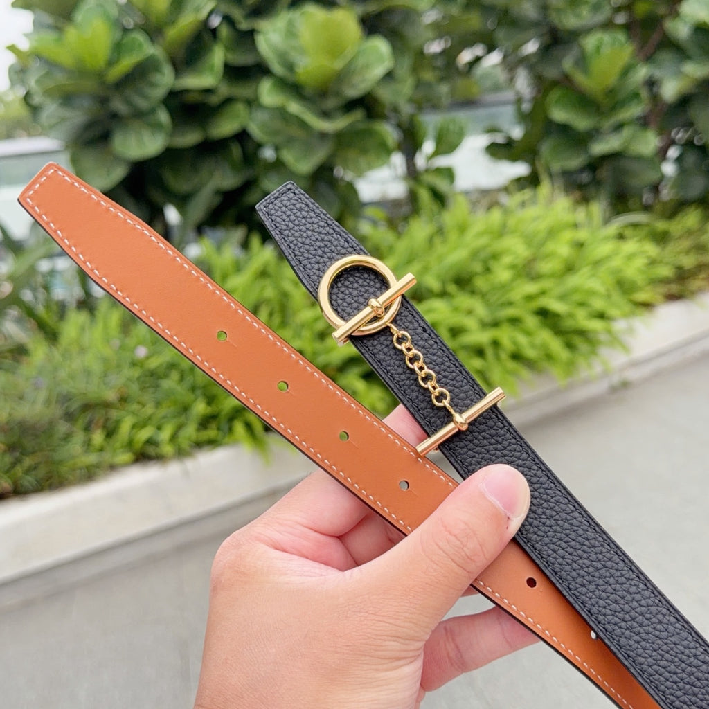 Black leather belt with tan strap and gold-tone buckle, chain link