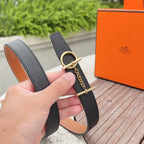 Black leather belt with tan reverse, gold ring buckle and chain