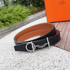 Hermes belt in dark leather with tan lining, silver buckle and linked chain