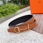 Brown leather belt with gold buckle and chain, black-lined underside