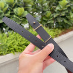 Gray leather belt with gold buckle and punched holes row