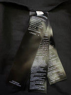 Balenciaga fabric care label inside neck tag with multilingual text
