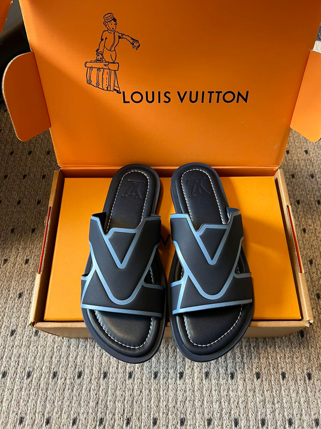 Louis Vuitton slide sandals, black with light blue V logo straps