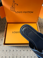 Louis Vuitton slide sandal, black sole and footbed with light blue V logo