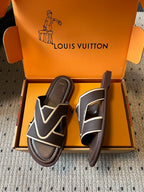 Dark slide sandals with white V-shaped strap detail