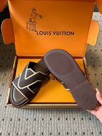 Dark slide sandals with white V strap, shown with gray outsole