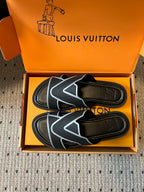 Pair of Louis Vuitton sandals in box, black footbeds with light blue V logo on straps