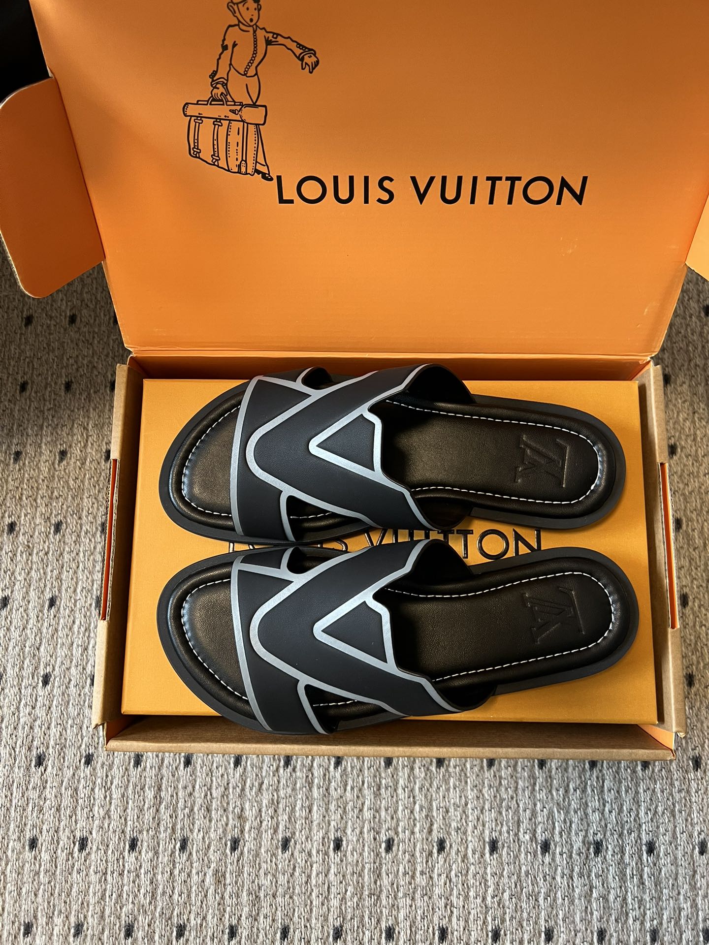 Pair of Louis Vuitton sandals in box, black footbeds with light blue V logo on straps