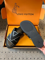 Louis Vuitton sandals in open box with black footbed, black-and-light blue V strap details