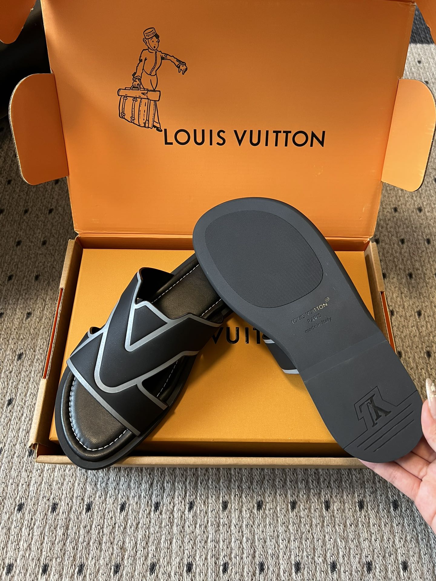 Louis Vuitton sandals in open box with black footbed, black-and-light blue V strap details