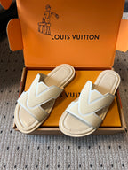 Pair of cream slide sandals with V strap detail and padded lining, Louis Vuitton