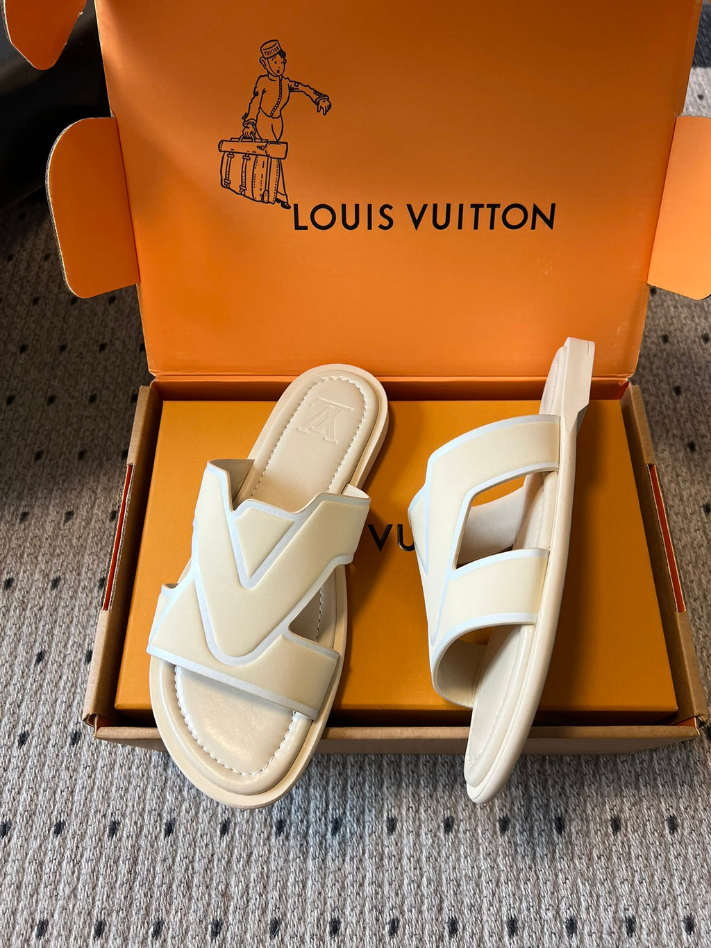 Cream slide sandals in open box, V-shaped straps with beige footbed, Louis Vuitton