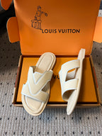 Cream slide sandals in open box, V-shaped straps with beige footbed, Louis Vuitton