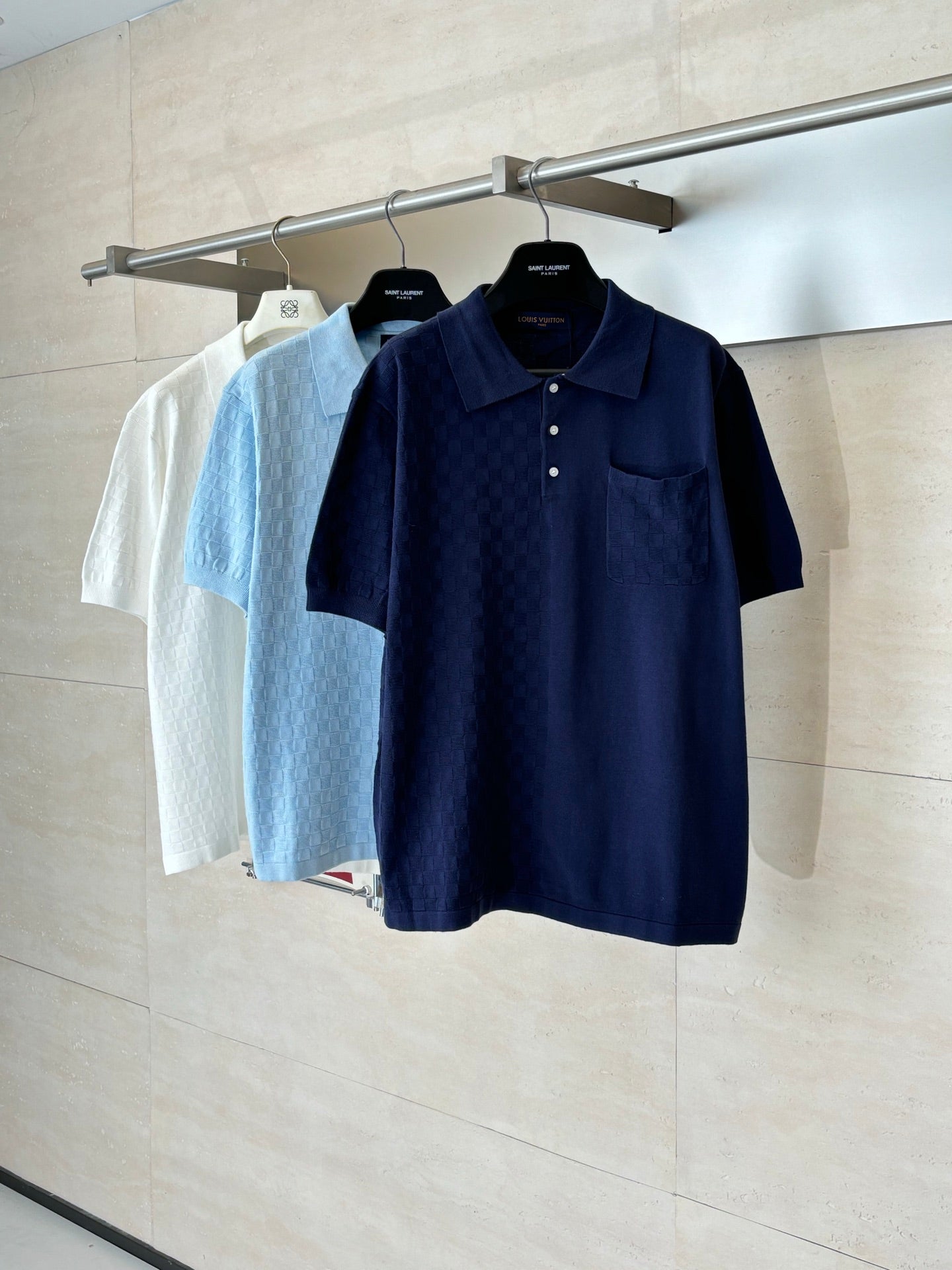 Louis Vuitton polo shirts: dark navy and light blue short sleeves on hangers