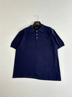 Navy short-sleeve polo shirt with textured check pattern and chest pocket