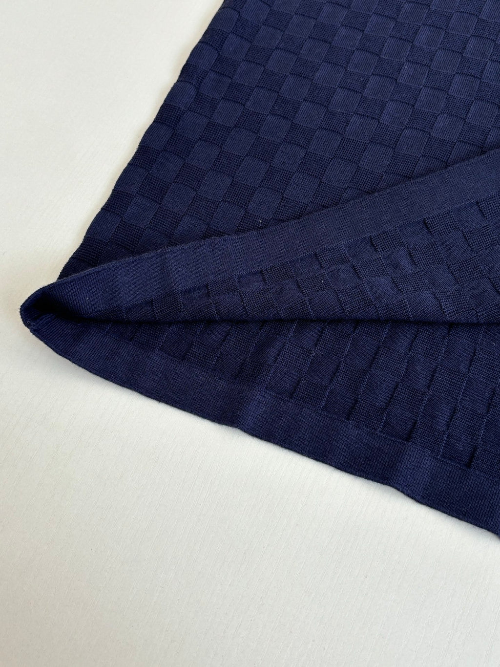 Louis Vuitton dark navy polo shirt fabric detail along sleeve seam