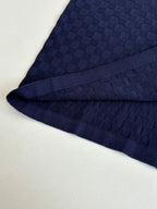 Louis Vuitton dark navy polo shirt fabric detail along sleeve seam