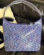 Blue patterned hobo bag with open top and short shoulder handles.