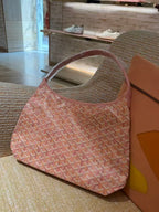 Pink patterned tote bag with wide handles and structured open top