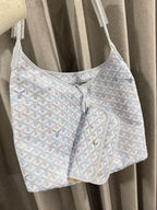 Goyard handbag in light blue with white pattern and attached zip pouch.