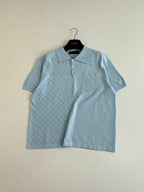 Light blue short-sleeve polo shirt with collar and chest pocket