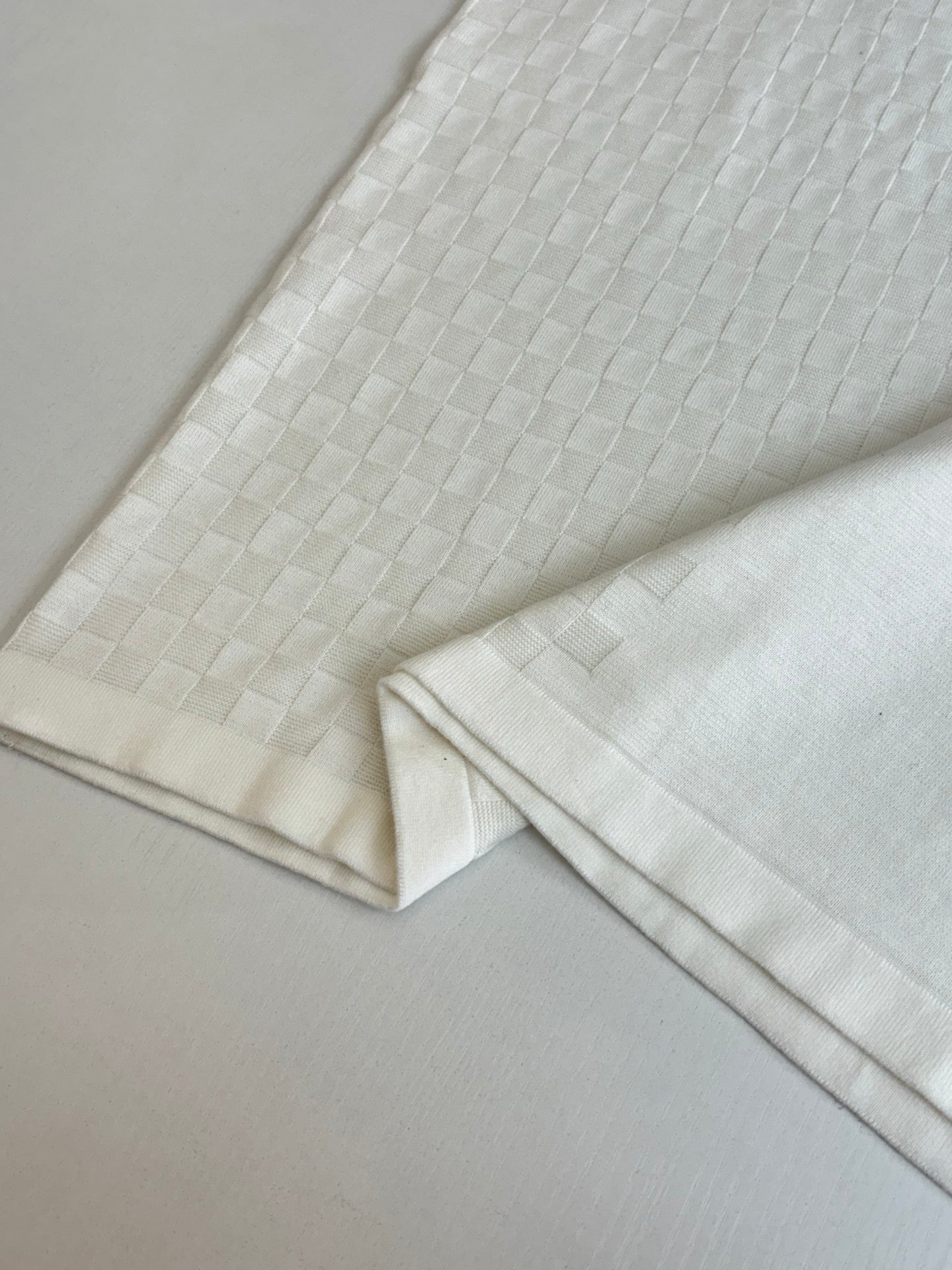 White textured polo sleeve and hem section