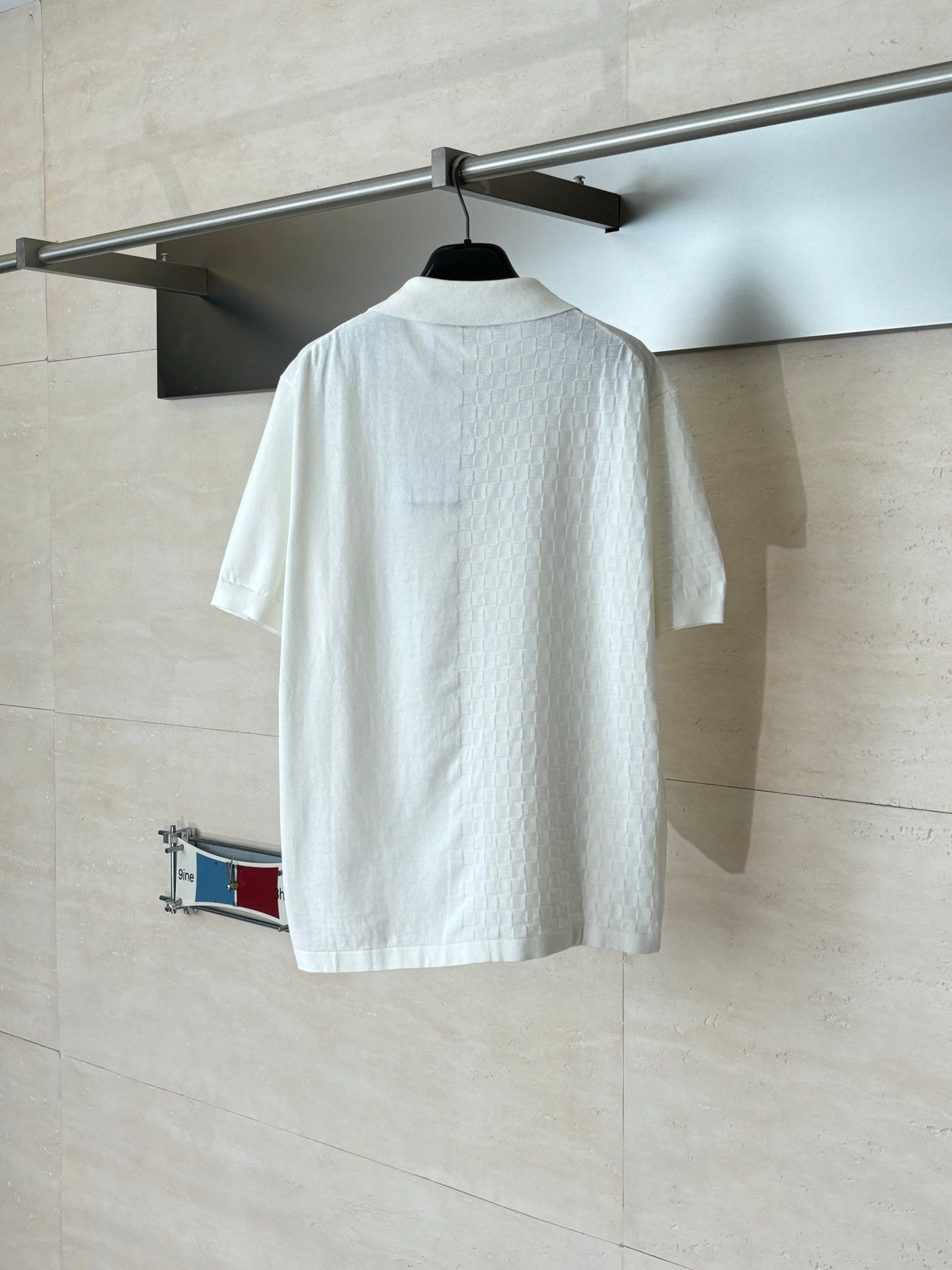 White short-sleeve polo shirt with back yoke and button placket