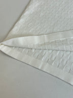 White textured polo fabric with folded cuff and hem detail
