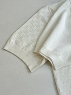 White polo sleeve and placket with textured checker fabric