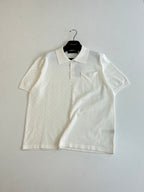 White short-sleeve polo shirt with open collar and button front