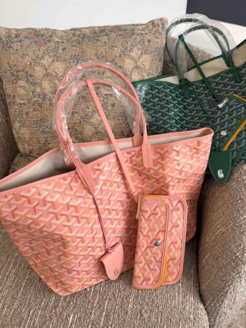 Pink patterned tote bag set with matching small pouch and shoulder strap, laid out view.