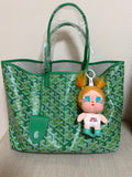 Green patterned tote bag with plush doll charm and small pouch