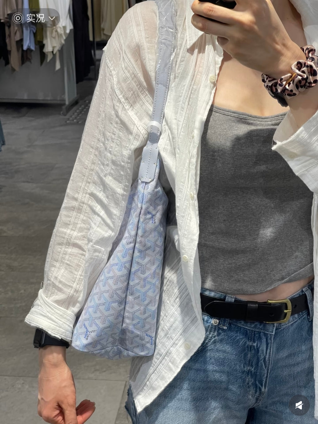 Light blue patterned hobo tote bag with zip-top and side fold