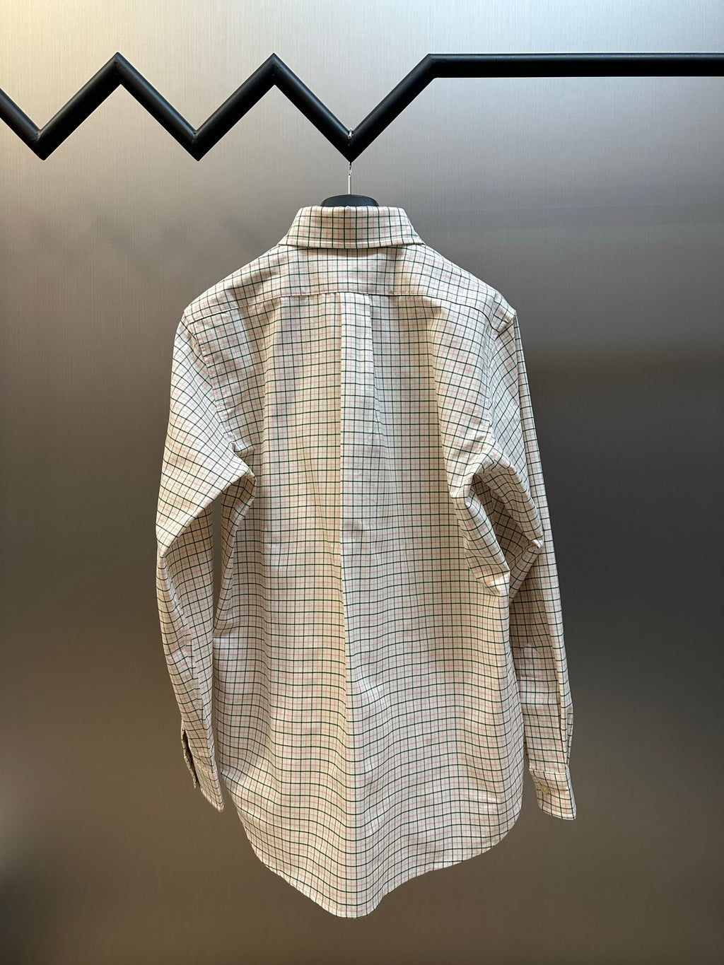 Plaid button-up shirt back view with yoke and shoulder seams.