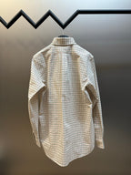 Plaid button-up shirt back view with yoke and shoulder seams.