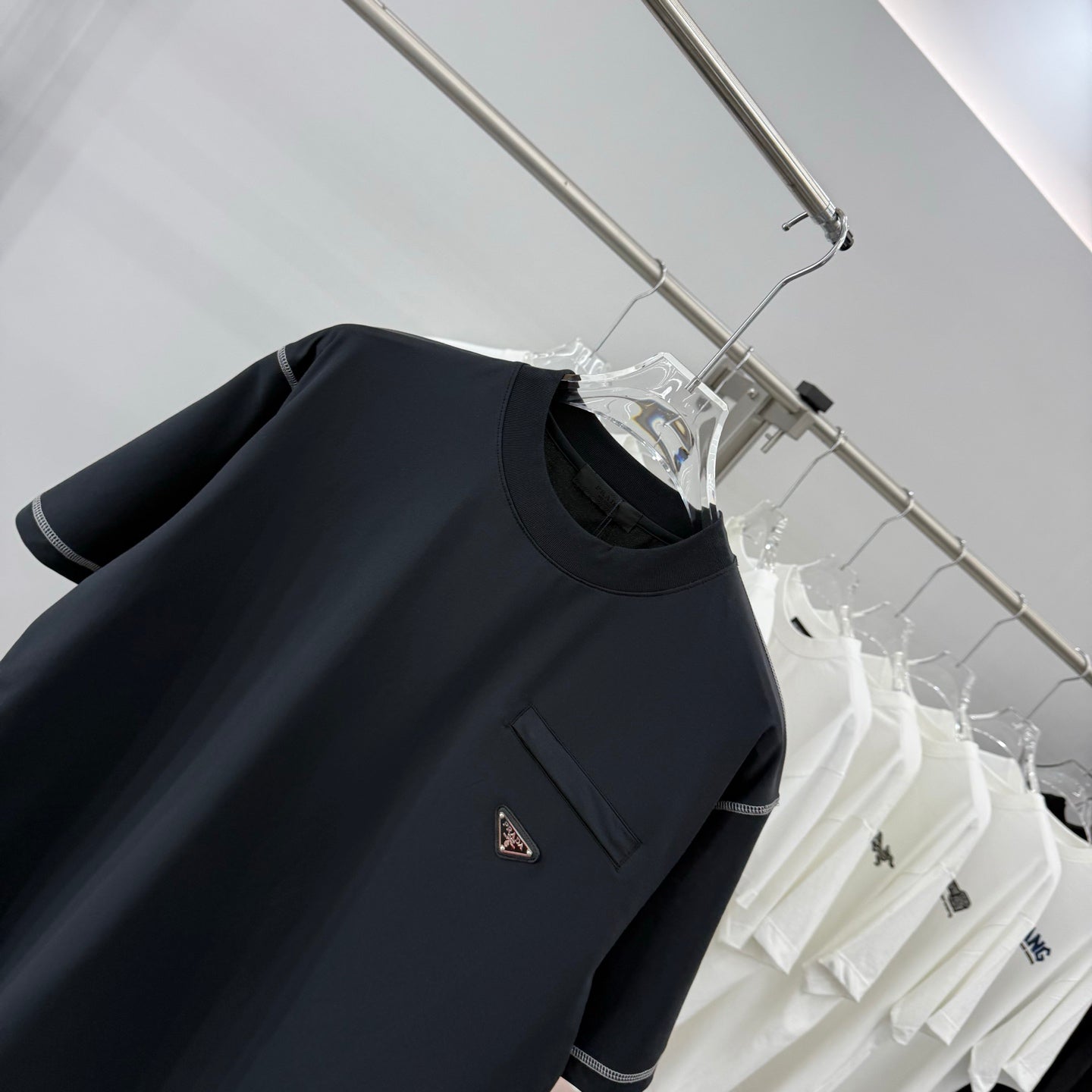 Prada short-sleeve T-shirt, dark navy, logo patch on chest pocket, crew neck