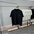 Prada short-sleeve T-shirt, dark navy, crew neck, chest pocket, triangular logo patch