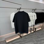 Prada short-sleeve T-shirt, dark navy, crew neck, chest pocket, logo patch