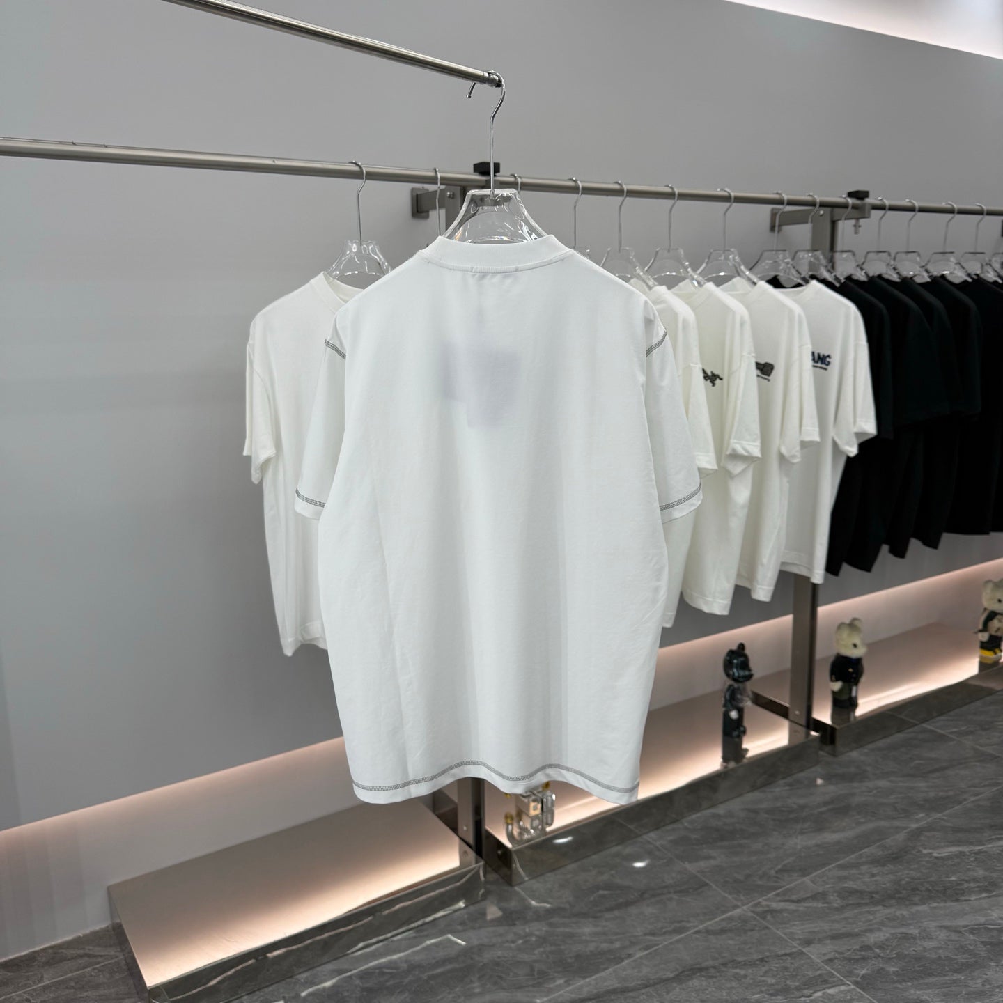 White short-sleeve crewneck T-shirt displayed on a hanger