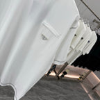 White short-sleeve T-shirt with chest pocket, side trim, and logo patch