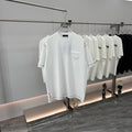 White short-sleeve T-shirt with crew neck and chest pocket on a display hanger