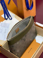 Louis Vuitton monogram small bag with front zip pocket and brown leather tab