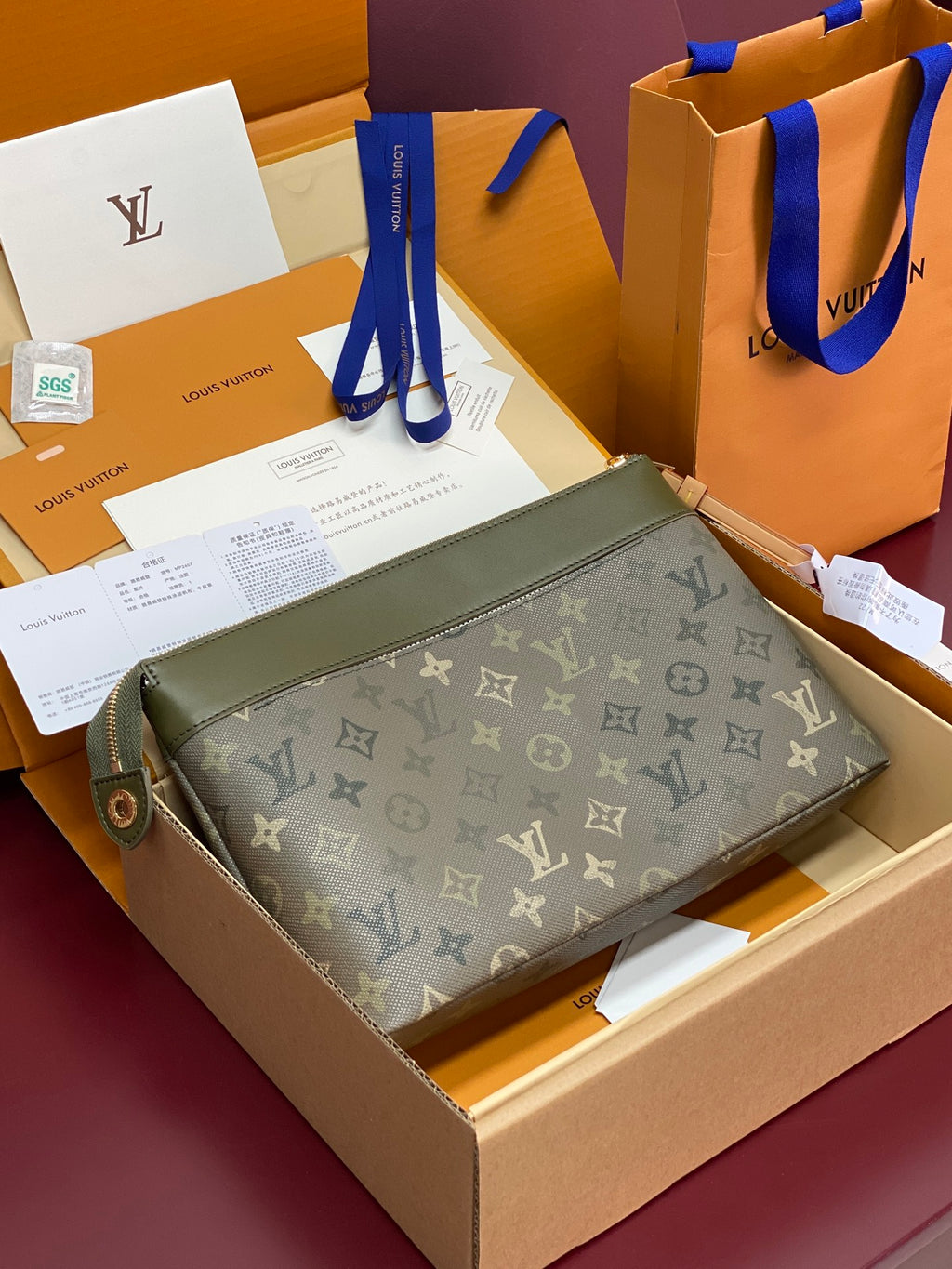 Louis Vuitton small monogram toiletry-style bag, dark olive green, zip-top