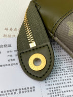 Louis Vuitton small bag front panel with green leather, circular gold snap and stitched edge