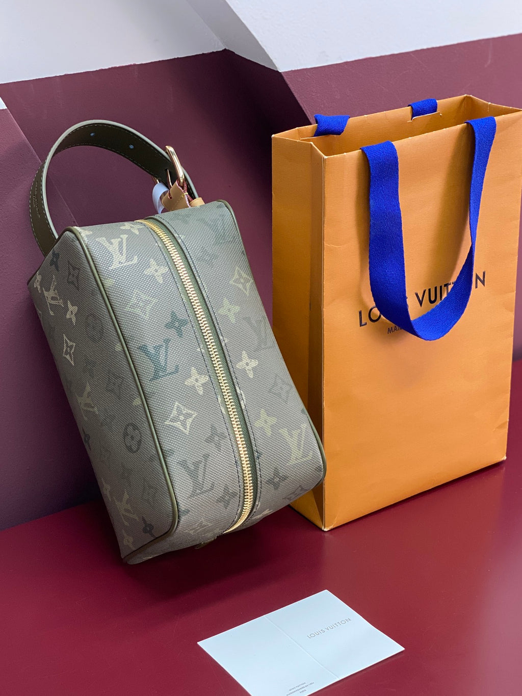 Louis Vuitton monogram small toiletry bag with curved silhouette and zip closure