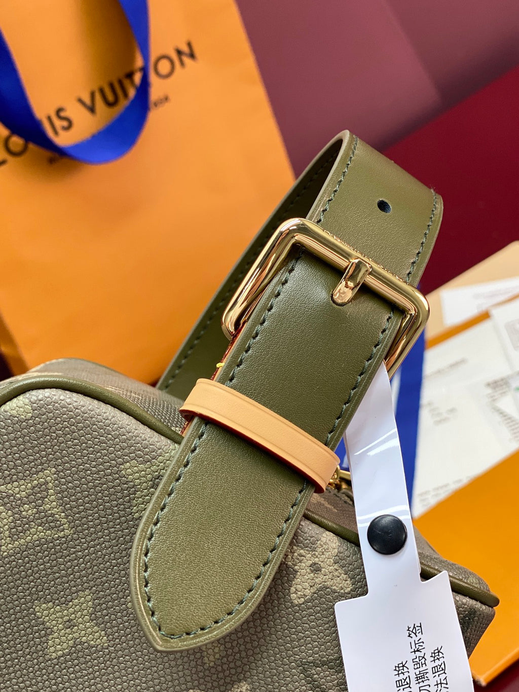 Louis Vuitton small toiletry bag with adjustable D-ring strap detail