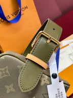 Olive leather strap detail with gold buckle hardware and monogram bag body