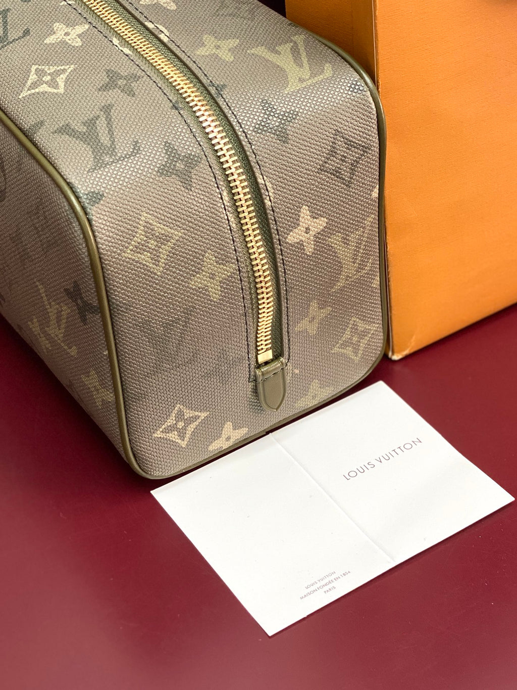 Louis Vuitton monogram small toiletry bag close-up of front zipper and pattern